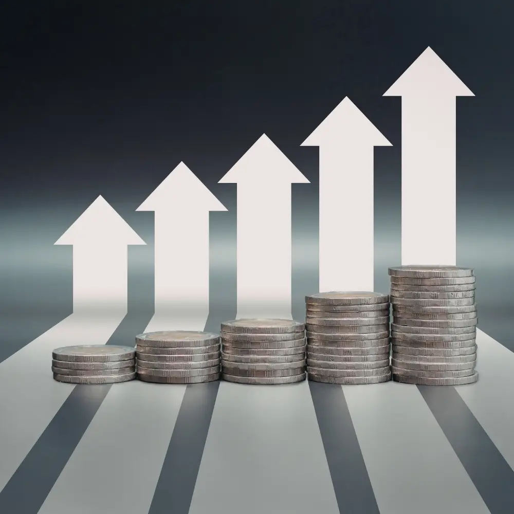 Stacks of coins with rising arrows, symbolizing financial growth through home loans and purchase home loans.