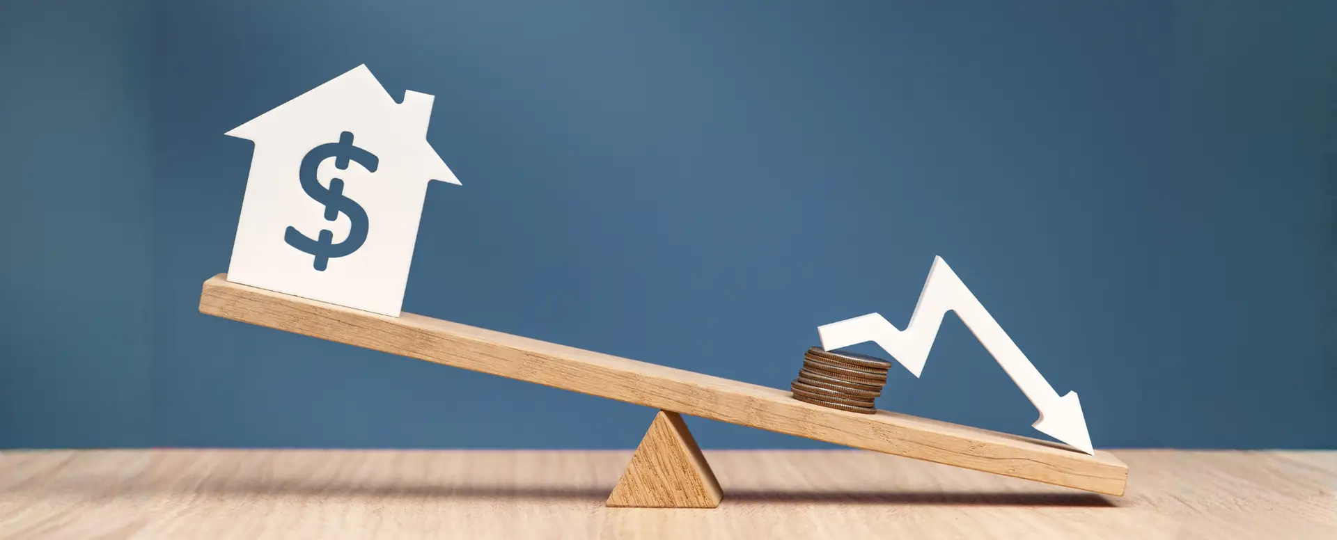 A seesaw with a house and dollar sign outweighing coins and arrow, highlighting challenges for first-time home buyers.